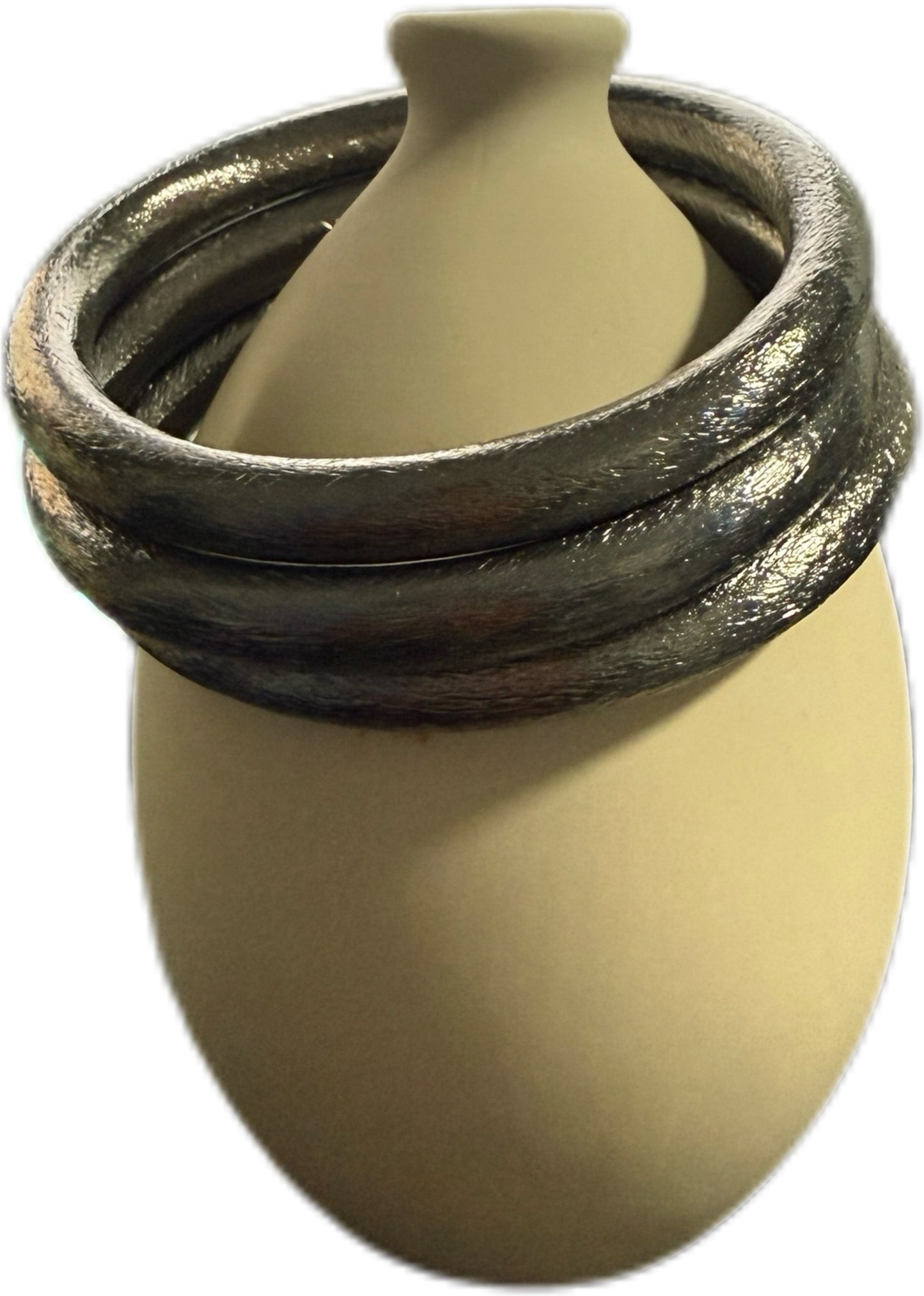 A set of three Pewter color bangles. 